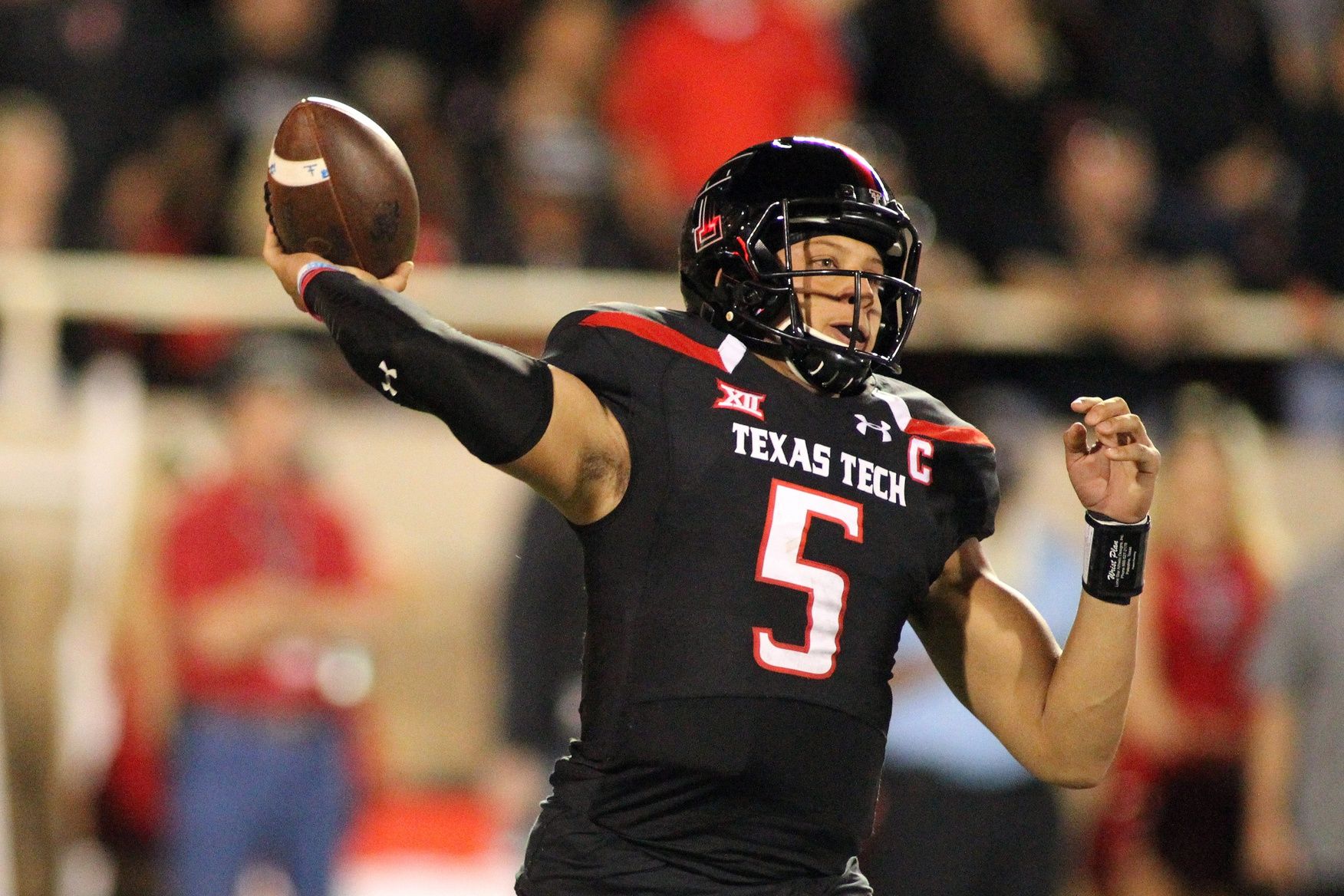 Patrick Mahoms (5) passes against the Oklahoma Sooners in the first half at Jones AT&T Stadium.