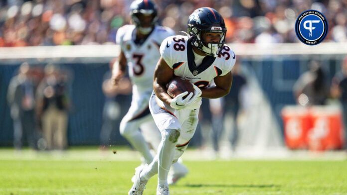 Jaleel McLaughlin (38) runs with the ball against the Chicago Bears at Soldier Field.