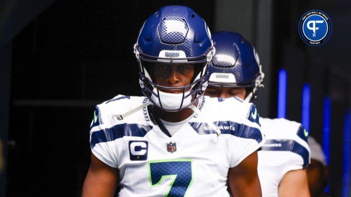 Seattle Seahawks QB Geno Smith leads his team to the field.