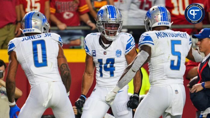 Detroit Lions WR Amon-Ra St. Brown celebrates with teammates after scoring a TD.