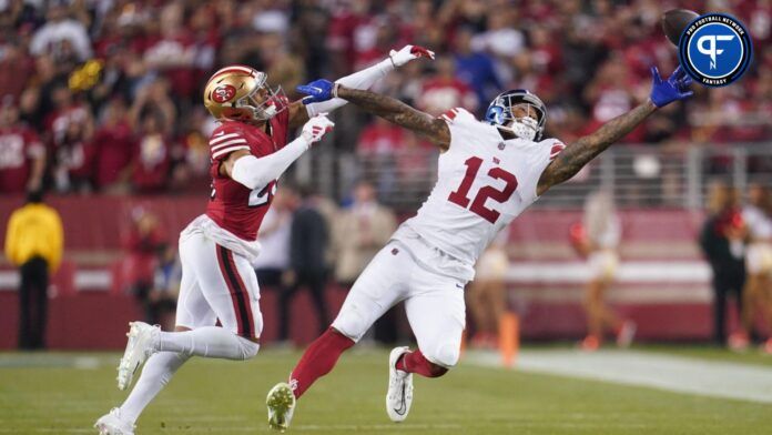 New York Giants TE Darren Waller dives for pass against San Francisco 49ers defender.