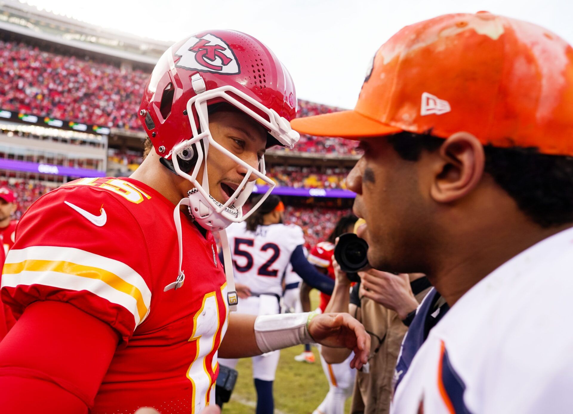 Kansas City Chiefs QB Patrick Mahomes (15) and Denver Broncos QB Russell Wilson (3) talk after a game.