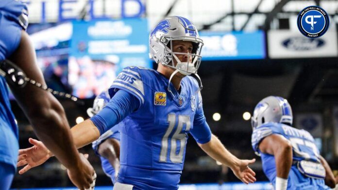 Detroit Lions quarterback Jared Goff high-fives teammates during warmups before the game vs. the Carolina Panthers at Ford Field.