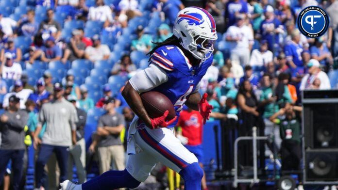 James Cook (4) warms up prior to the game against the Miami Dolphins at Highmark Stadium.