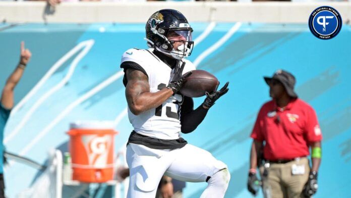 Christian Kirk (13) catches a touchdown pass during the second half against the Houston Texans at EverBank Stadium.