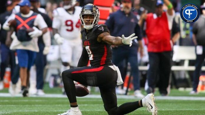 Kyle Pitts (8) reacts after a first down against the Houston Texans in the second quarter at Mercedes-Benz Stadium.