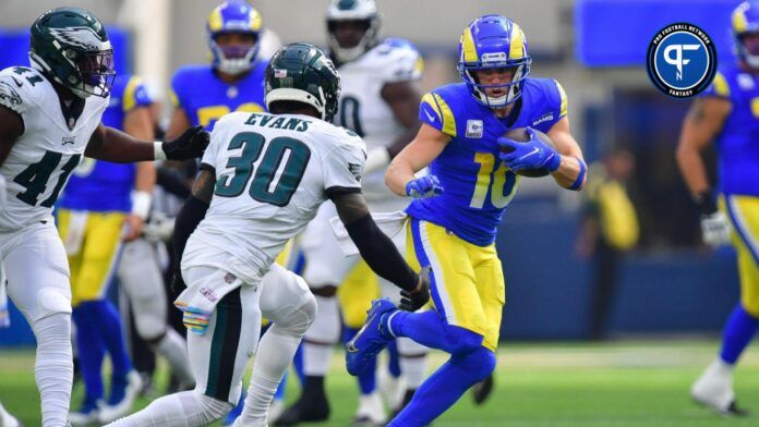 Los Angeles Rams wide receiver Cooper Kupp (10) runs the ball against Philadelphia Eagles safety Justin Evans (30) during the first half at SoFi Stadium.