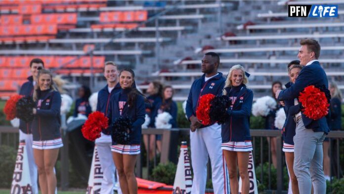 Auburn Tigers quarterback Bo Nix (10) hugs his fiancée, cheerleader Izzy Smoke, before taking on Mississippi State Bulldogs.