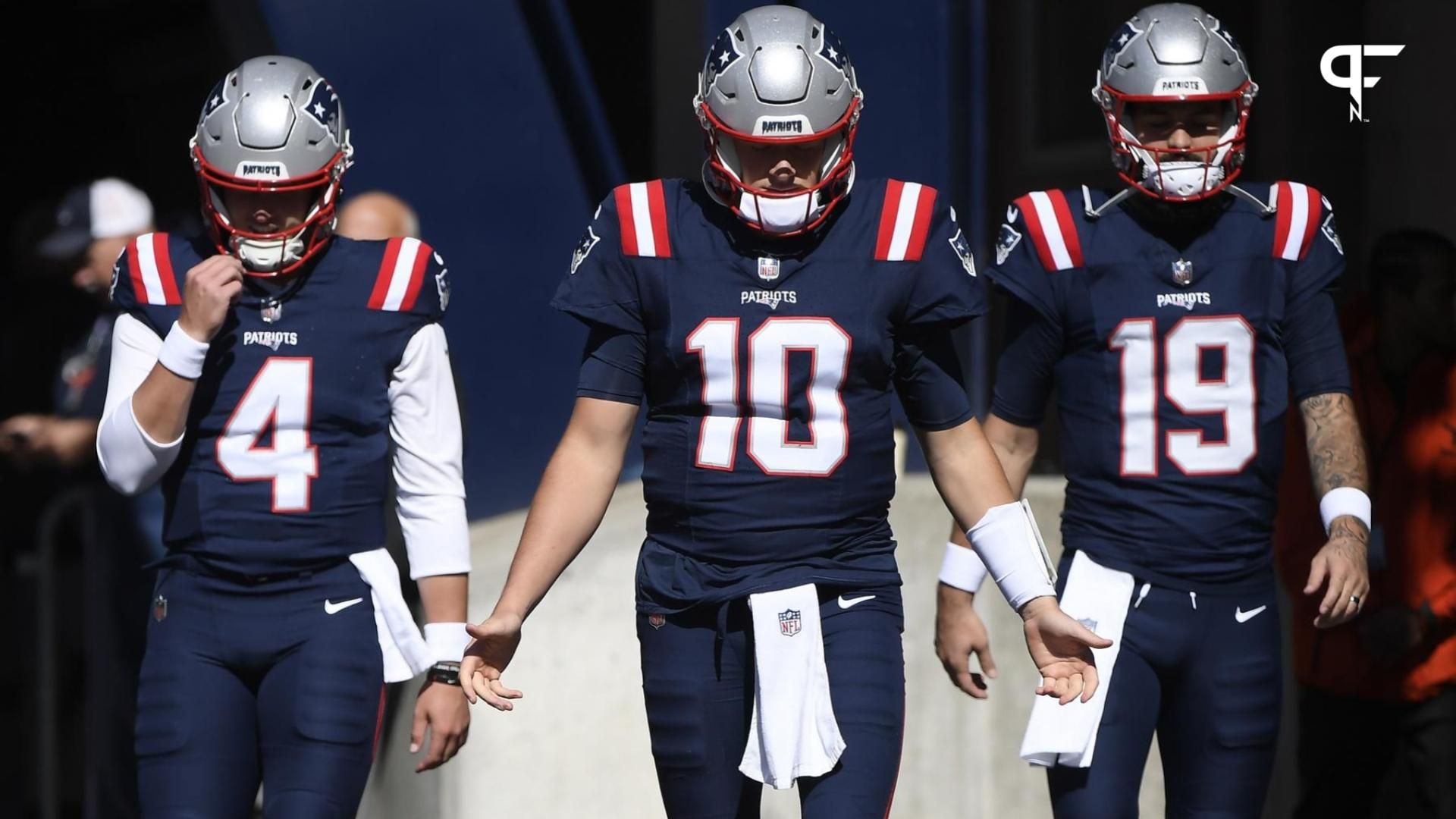 New England Patriots quarterback Bailey Zappe (4) quarterback Mac Jones (10) and quarterback Will Grier (19) walk out of the tunnel prior to a game against the New Orleans Saints.