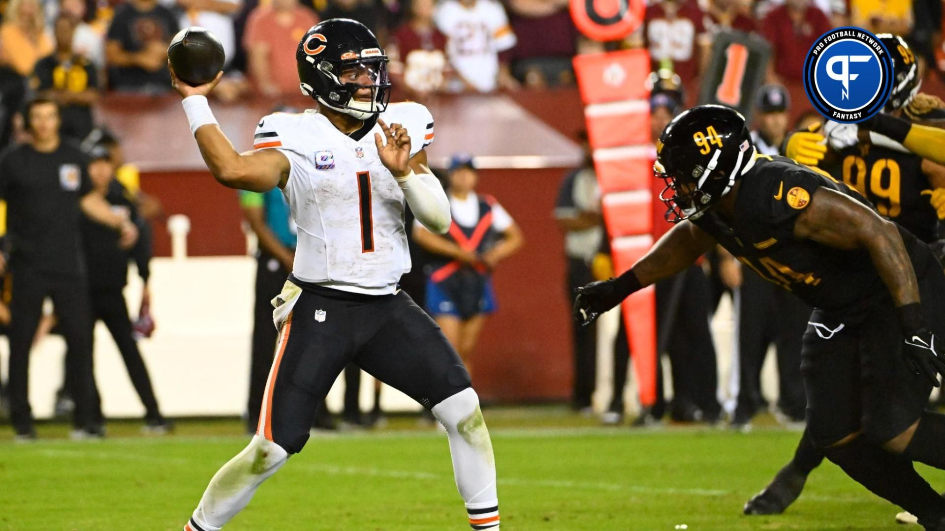 Chicago Bears quarterback Justin Fields (1) throws over Washington Commanders defensive tackle Daron Payne (94) during the second half at FedExField.