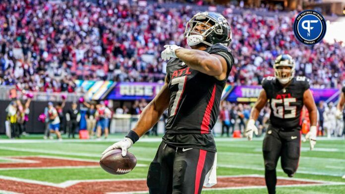 Atlanta Falcons running back Bijan Robinson (7) reacts after running for a touchdown after catching a pass against the Houston Texans during the second half at Mercedes-Benz Stadium.