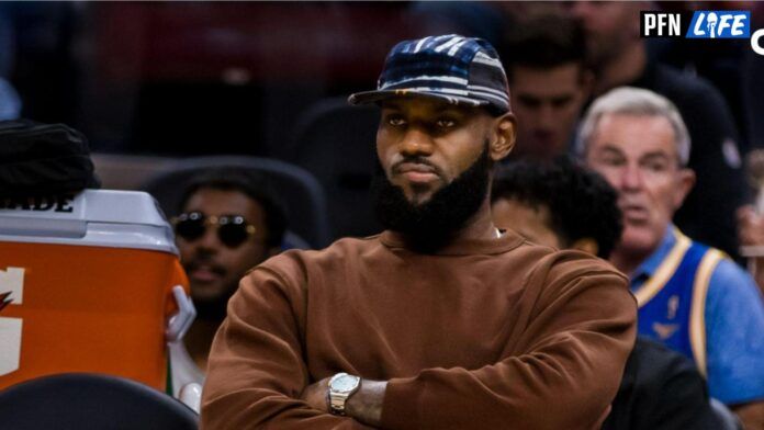 Los Angeles Lakers forward LeBron James (23) sits on the bench and watches the the game against the Golden State Warriors during the first half at Chase Center.