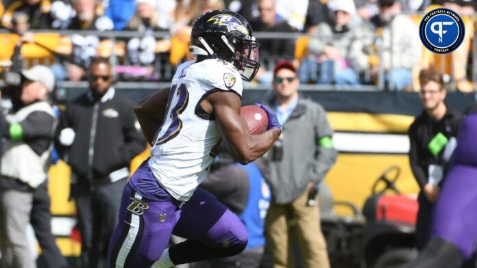 Justice Hill (43) runs for a 14 yard touchdown against the Pittsburgh Steelers during the first quarter at Acrisure Stadium.