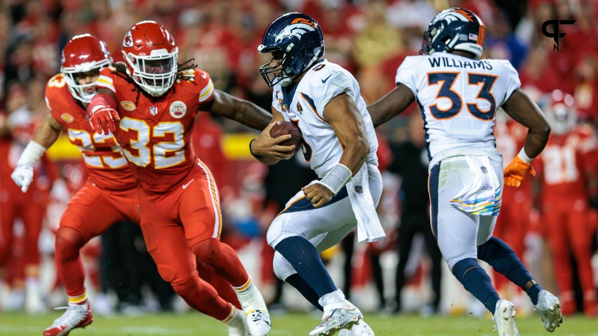 Denver Broncos quarterback Russell Wilson (3) scrambles in the back field during the fourth quarter against the Kansas City Chiefs at GEHA Field at Arrowhead Stadium.