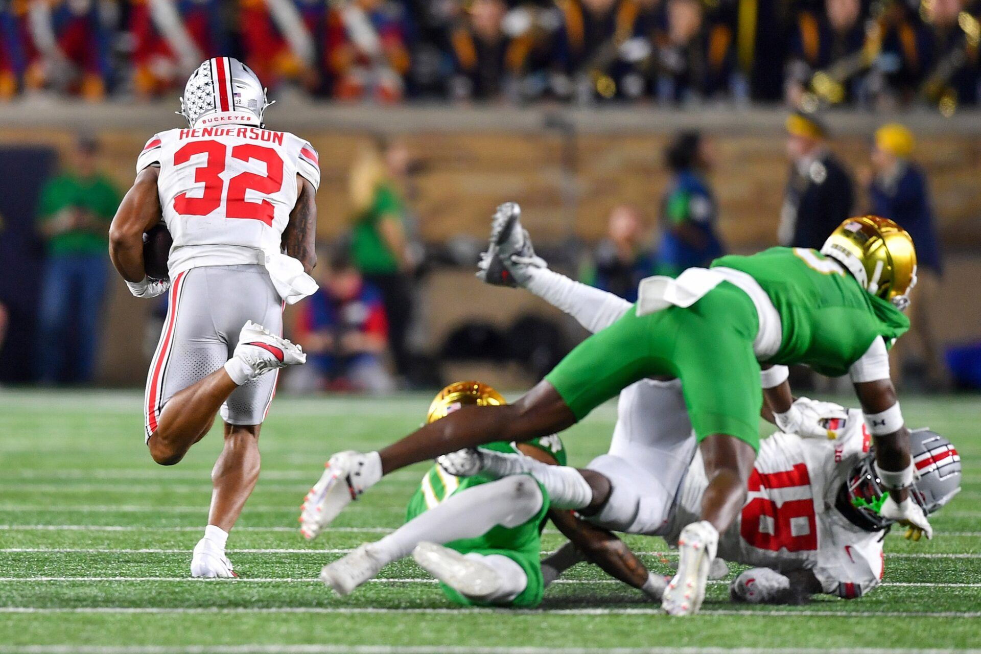 Ohio State Buckeyes running back TreVeyon Henderson (32) runs for a touchdown in the third quarter against the Notre Dame Fighting Irish.