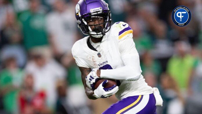 Minnesota Vikings WR Jordan Addison runs after the catch.