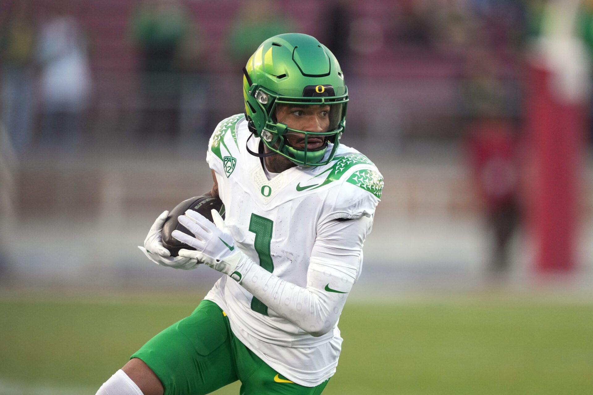 Oregon Ducks wide receiver Kris Hutson (1) runs after a catch against the Stanford Cardinal during the fourth quarter at Stanford Stadium.