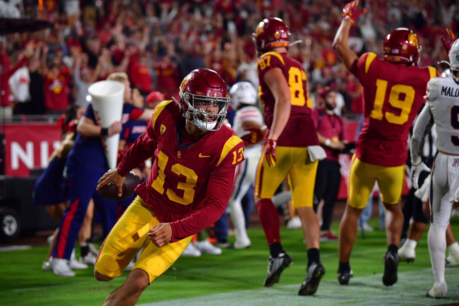 Southern California Trojans quarterback Caleb Williams (13) scores on the two point conversion against the Arizona Wildcats during the third overtime at Los Angeles Memorial Coliseum.