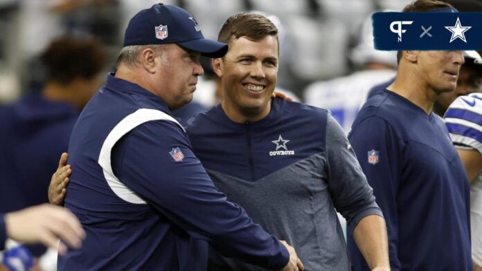 Mike McCarthy talks to offensive coordinator Kellen Moore before the game against the Cincinnati Bengals at AT&T Stadium.