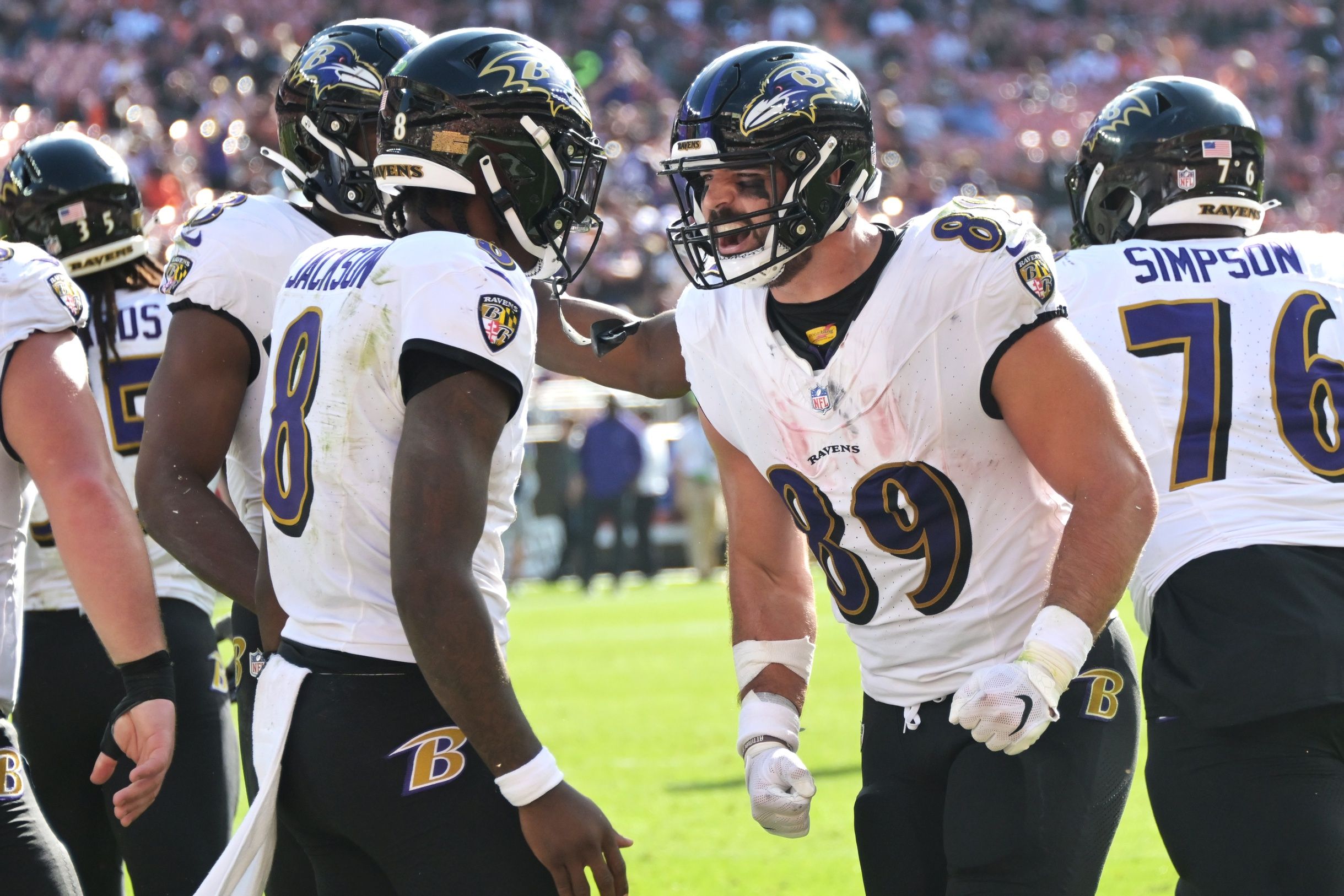 Mark Andrews (89) celebrates with quarterback Lamar Jackson (8) after catching a touchdown during the second half against the Cleveland Browns at Cleveland Browns Stadium.