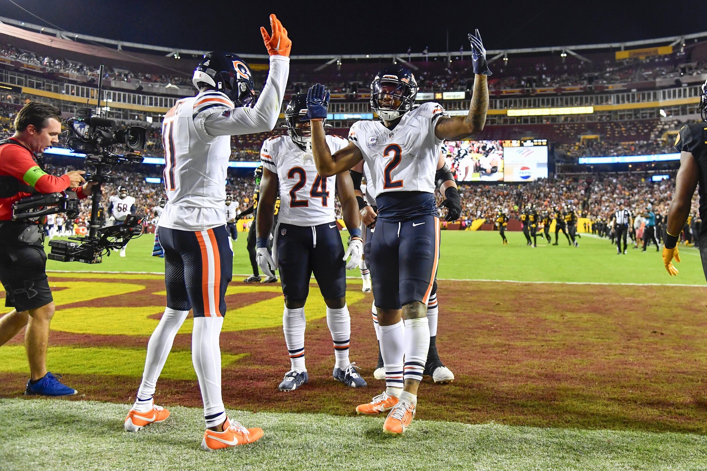 DJ Moore (2) celebrates after scoring a touchdown against the Washington Commanders during the first half at FedExField.