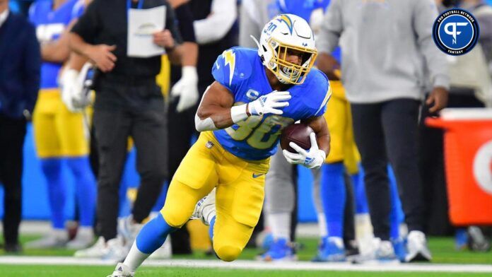 Austin Ekeler (30) runs the ball against the Miami Dolphins during the first half at SoFi Stadium.