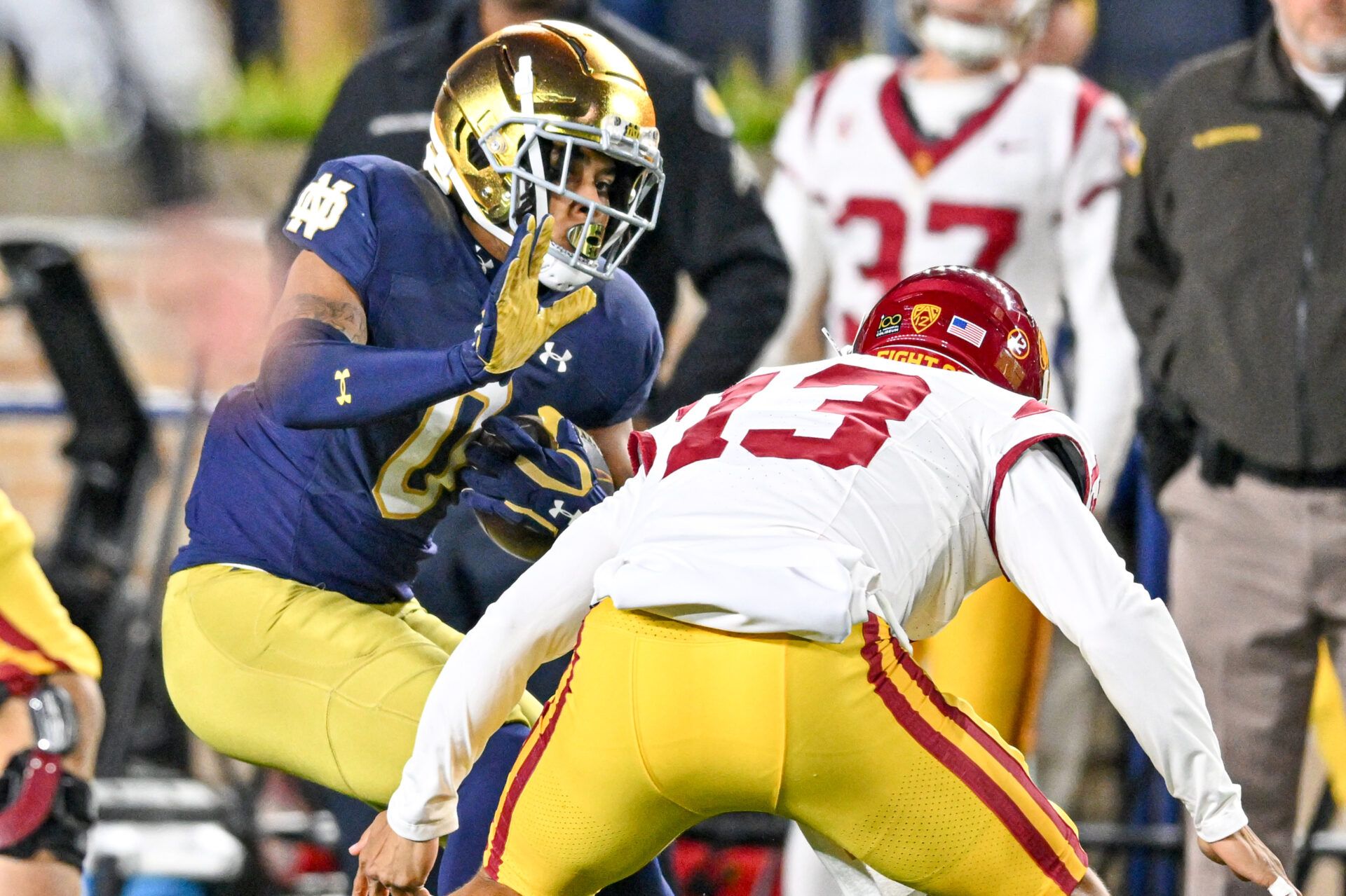 USC Trojans quarterback Caleb Williams (13) attempts to tackle Notre Dame Fighting Irish safety Xavier Watts (0) after Watts intercepted a pass in the first quarter at Notre Dame Stadium.