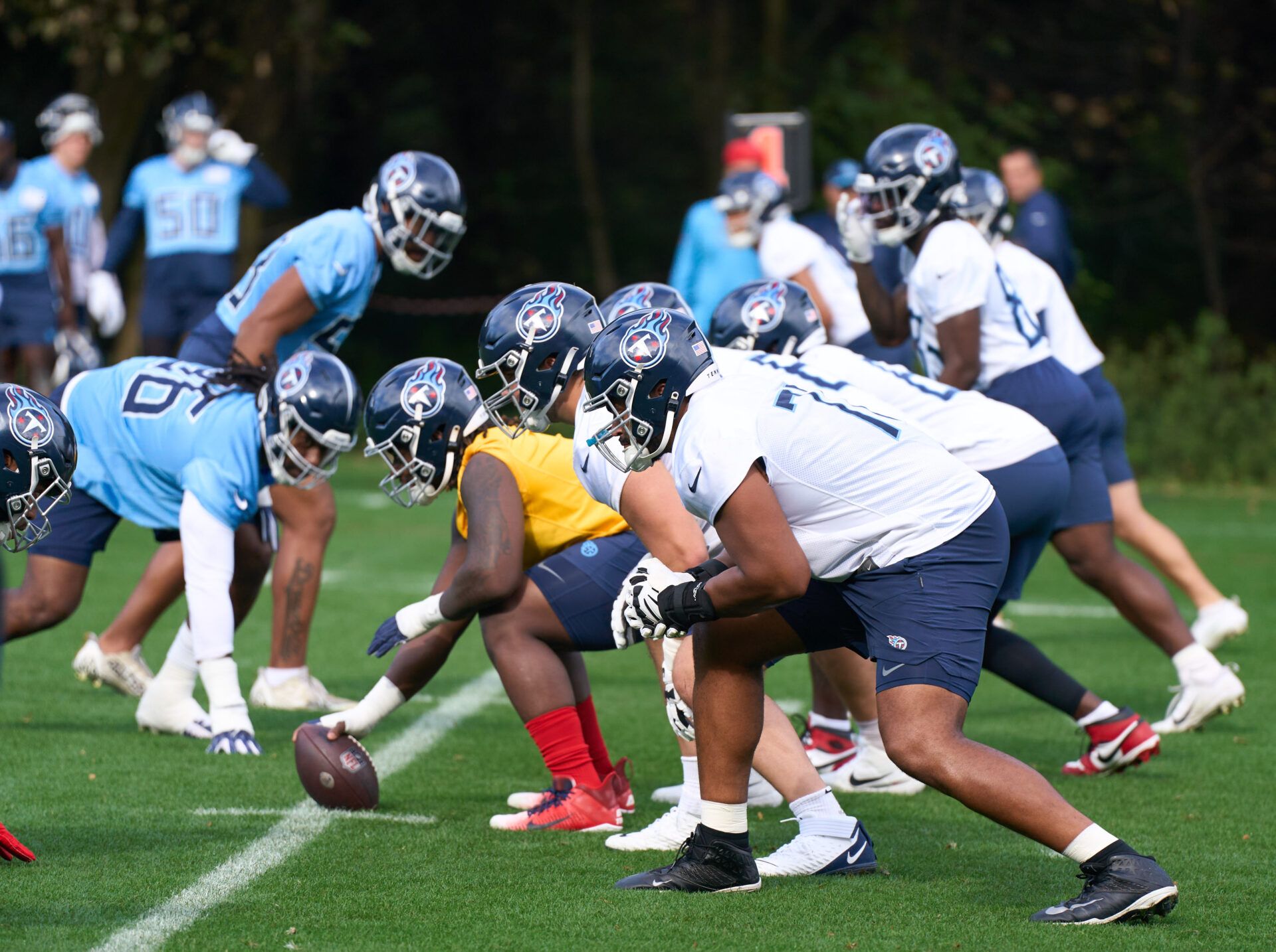 Tennessee Titans players line up for a snap during a practice session at The Grove, Watford for their upcoming NFL London game.