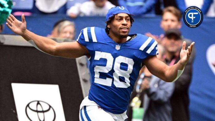 Indianapolis Colts running back Jonathan Taylor (28) runs onto the field during player introductions before the game against the Tennessee Titans at Lucas Oil Stadium.