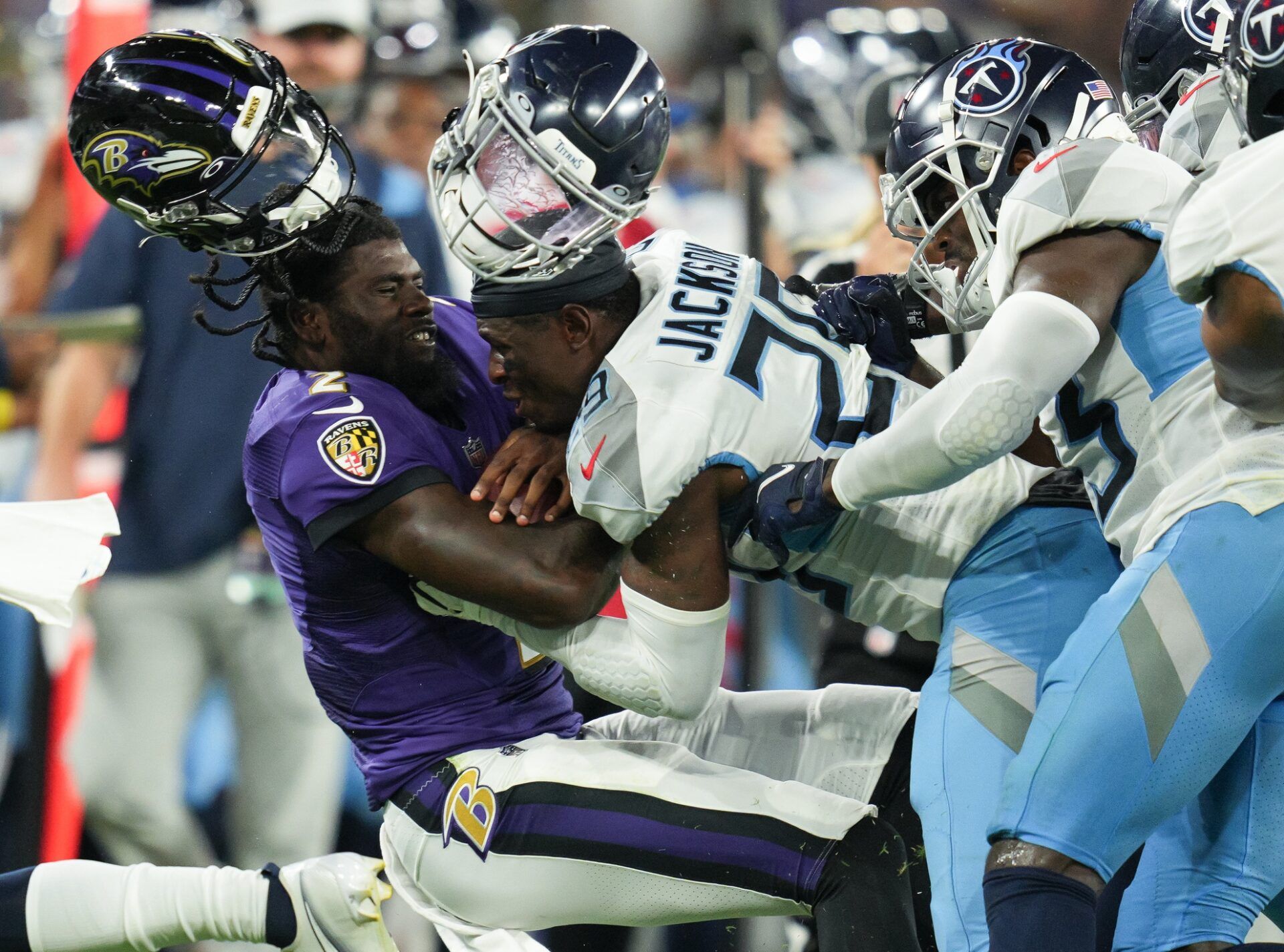 Tennessee Titans safety Theo Jackson (29) tackles Baltimore Ravens quarterback Tyler Huntley (2) during the second quarter of a preseason game at M&T Bank Stadium