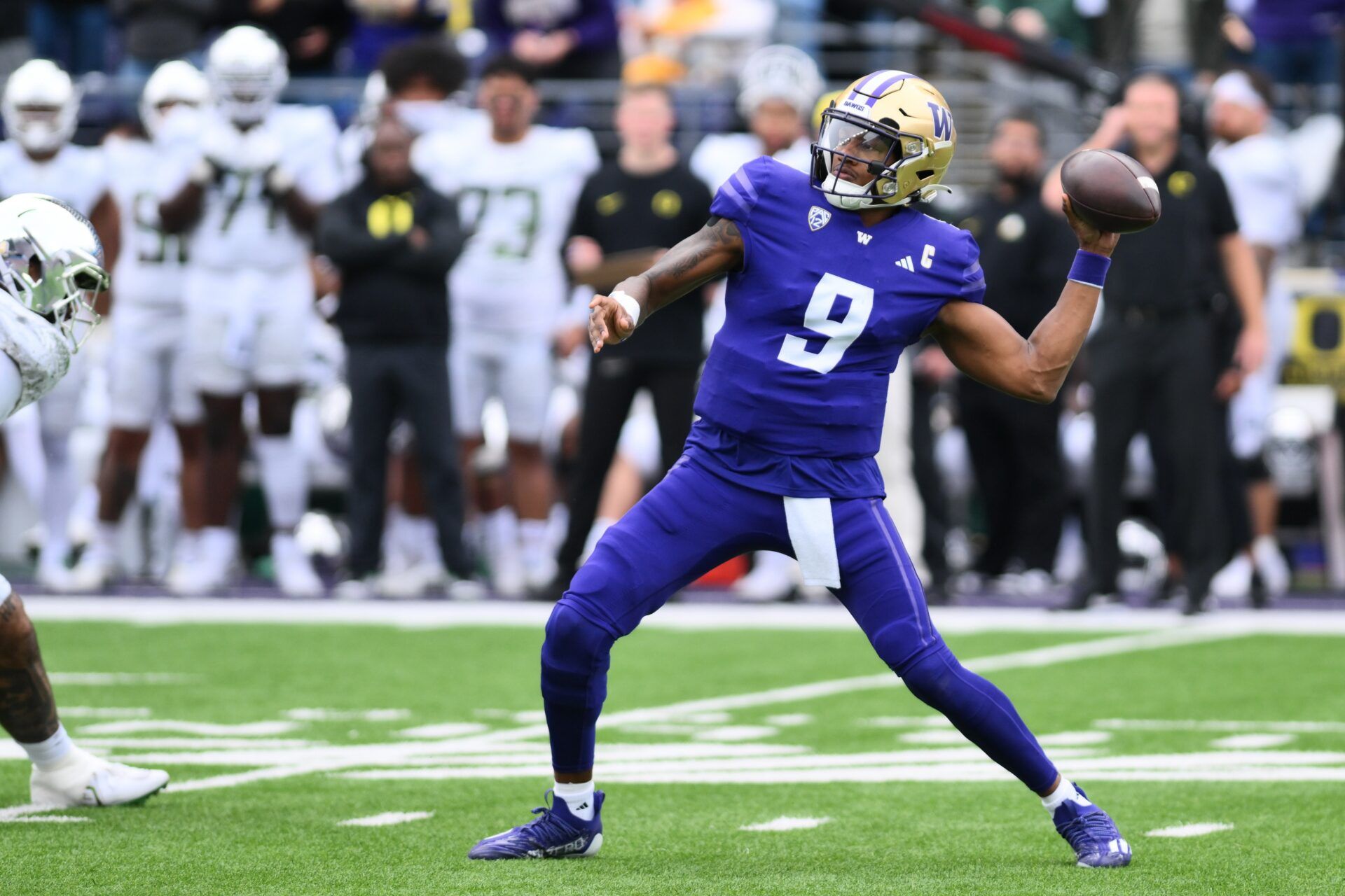 Washington Huskies QB Michael Penix Jr. (9) throws a deep pass against Oregon.