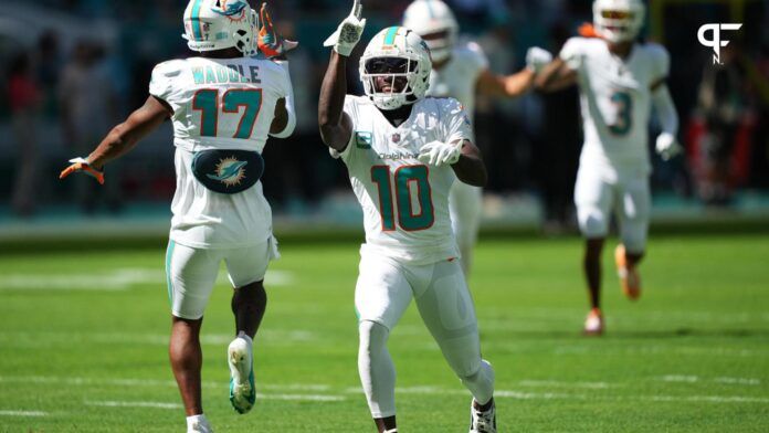 Miami Dolphins wide receiver Tyreek Hill (10) and wide receiver Jaylen Waddle (17) celebrate on the field prior to the game against the Carolina Panthers at Hard Rock Stadium.