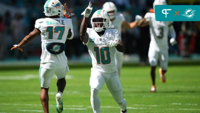 Tyreek Hill (10) and wide receiver Jaylen Waddle (17) celebrate on the field prior to the game against the Carolina Panthers at Hard Rock Stadium.