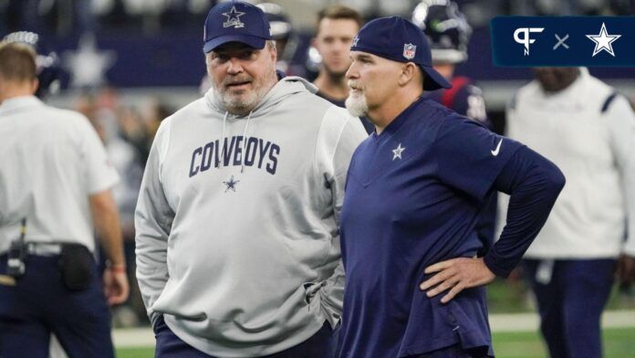 Dallas Cowboys head coach Mike McCarthy and defensive coordinator Dan Quinn talk at midfield prior to a game against the Houston Texans at AT&T Stadium.