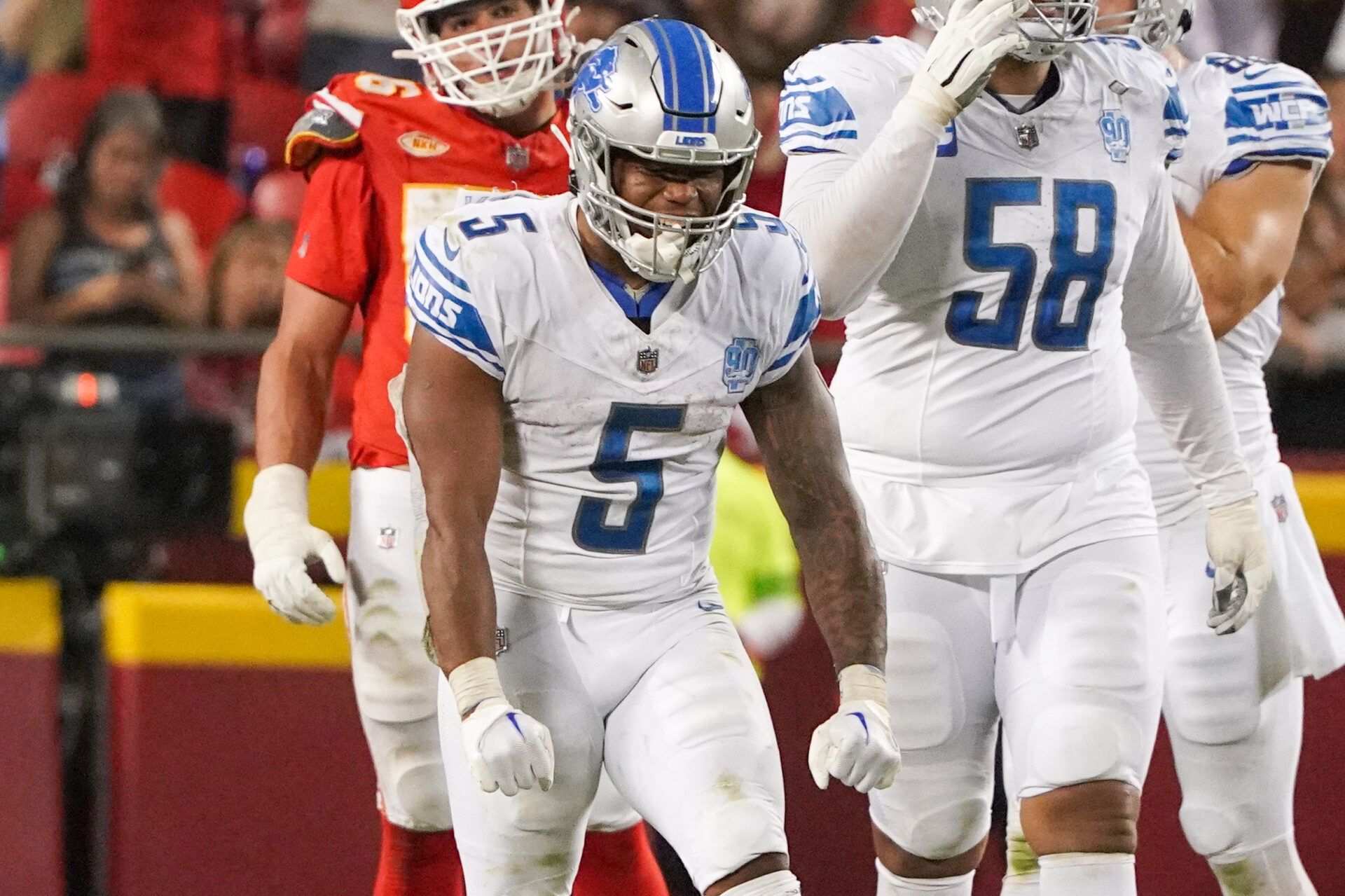 David Montgomery (5) celebrates after a down against the Kansas City Chiefs during the second half at GEHA Field at Arrowhead Stadium.