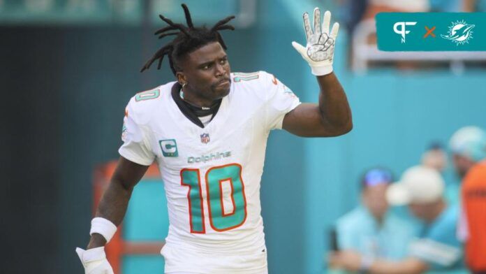 Tyreek Hill (10) reacts while taking on the field prior to the game against the Carolina Panthers at Hard Rock Stadium.