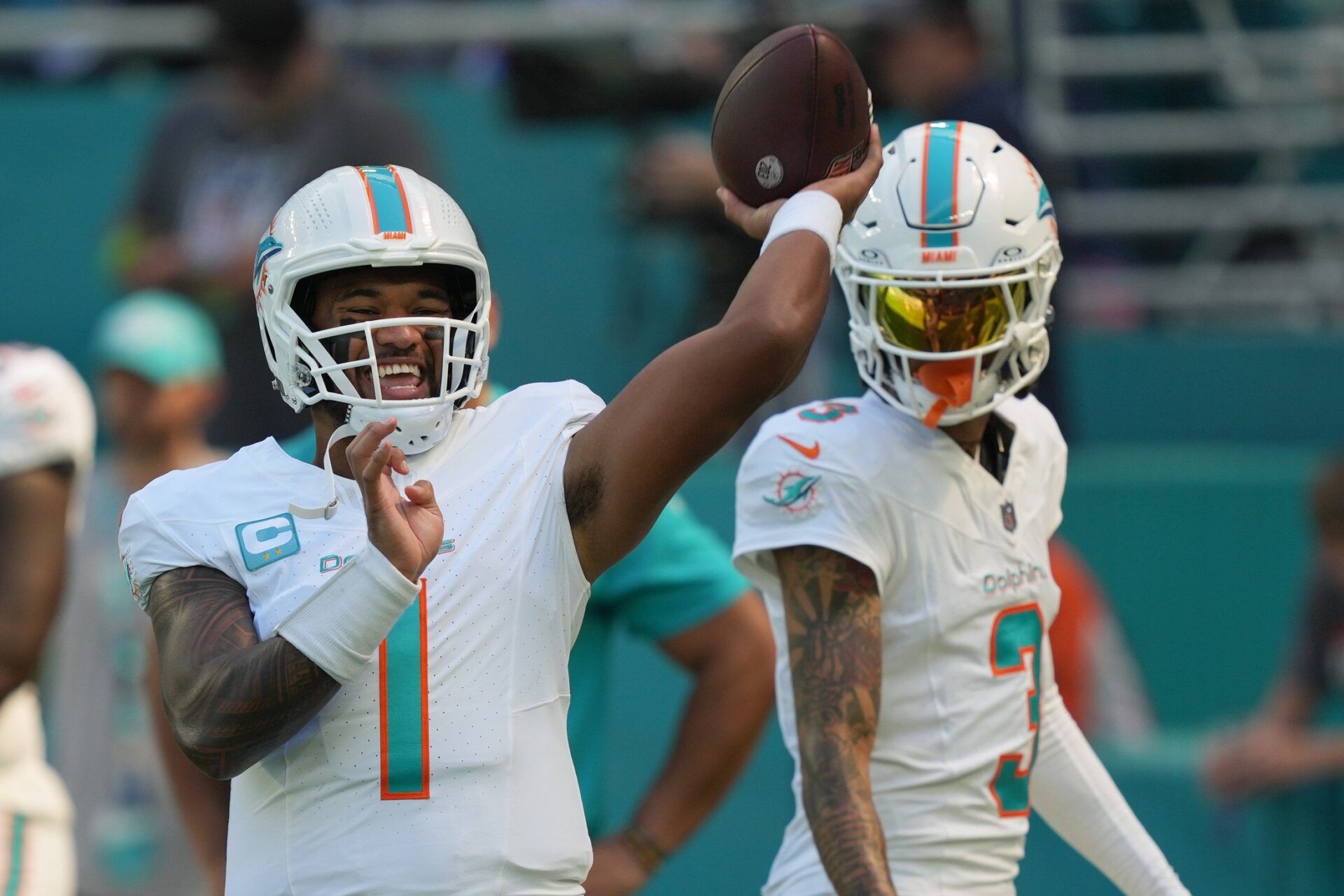 Tua Tagovailoa (1) warms-up before an NFL game against the Carolina Panthers at Hard Rock Stadium.