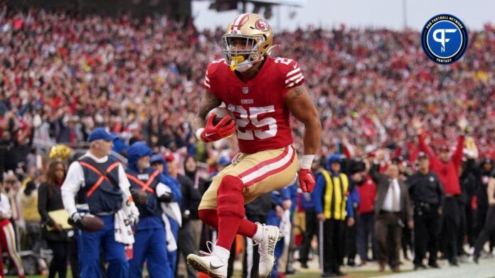 Elijah Mitchell (25) leaps into the end zone for a touchdown in the third quarter of a wild card game against the Seattle Seahawks at Levi's Stadium.