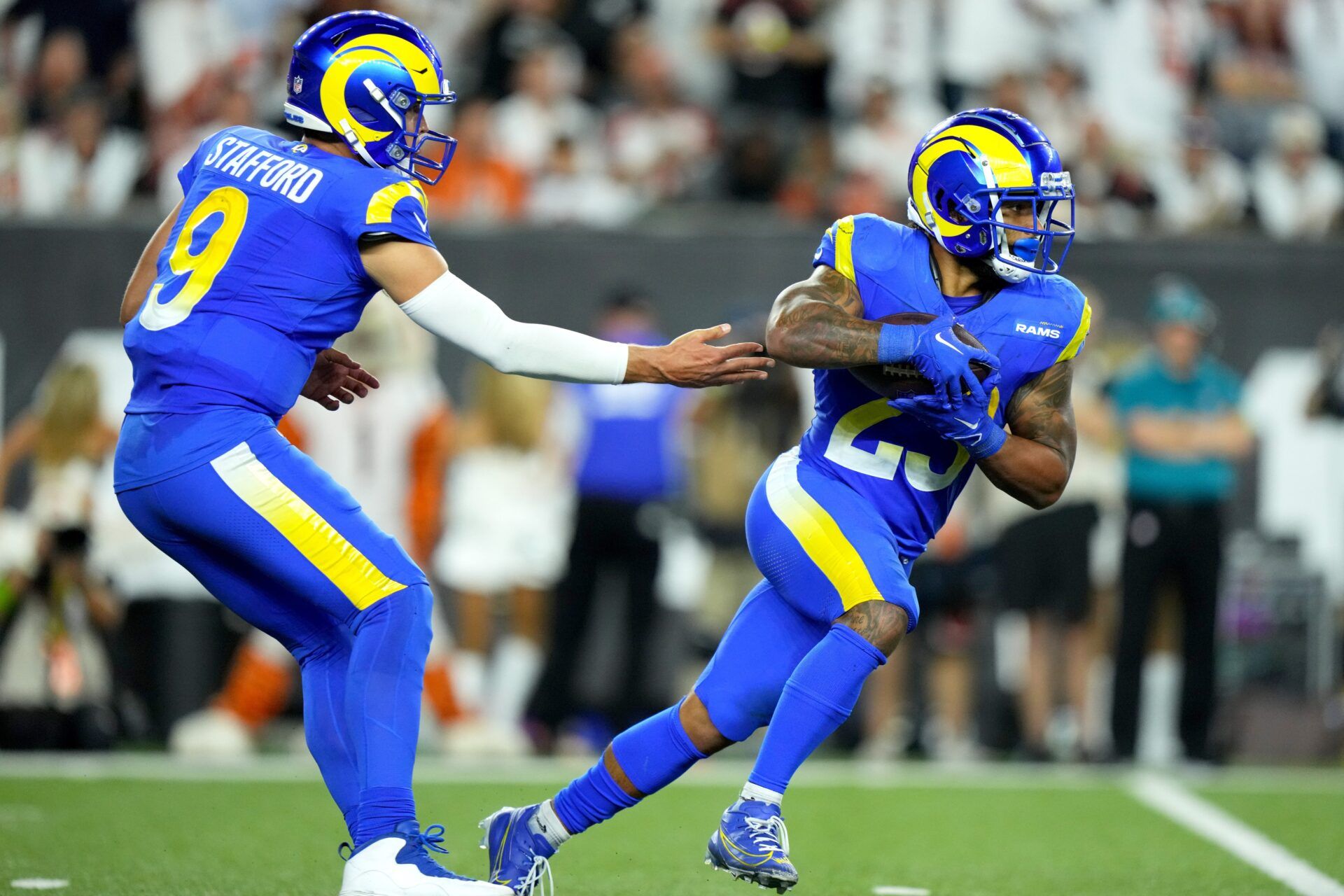 Matthew Stafford (9) hands offf to Los Angeles Rams running back Kyren Williams (23) in the third quarter during a Week 3 NFL football game.