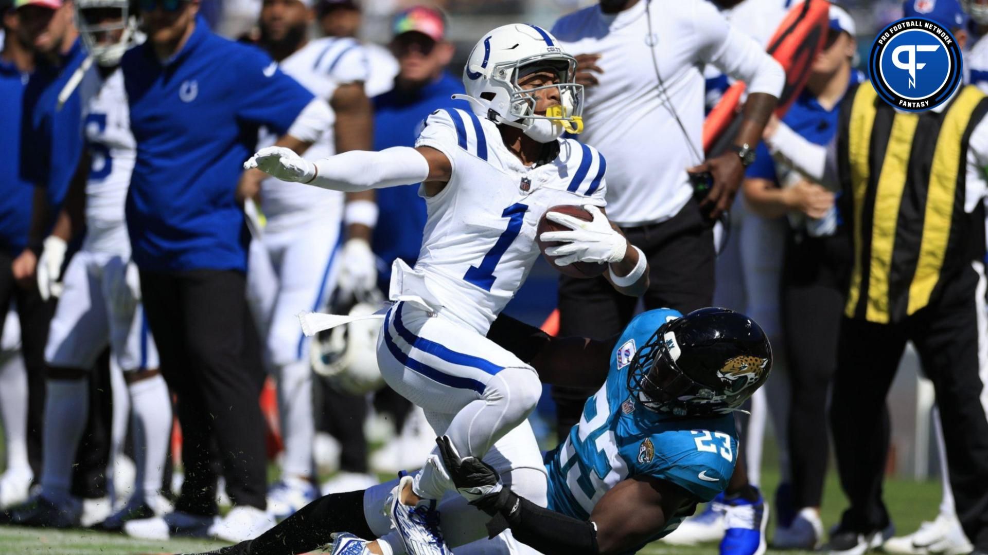 Josh Downs (1) is tackled by Jacksonville Jaguars linebacker Foyesade Oluokun (23) during the second quarter.