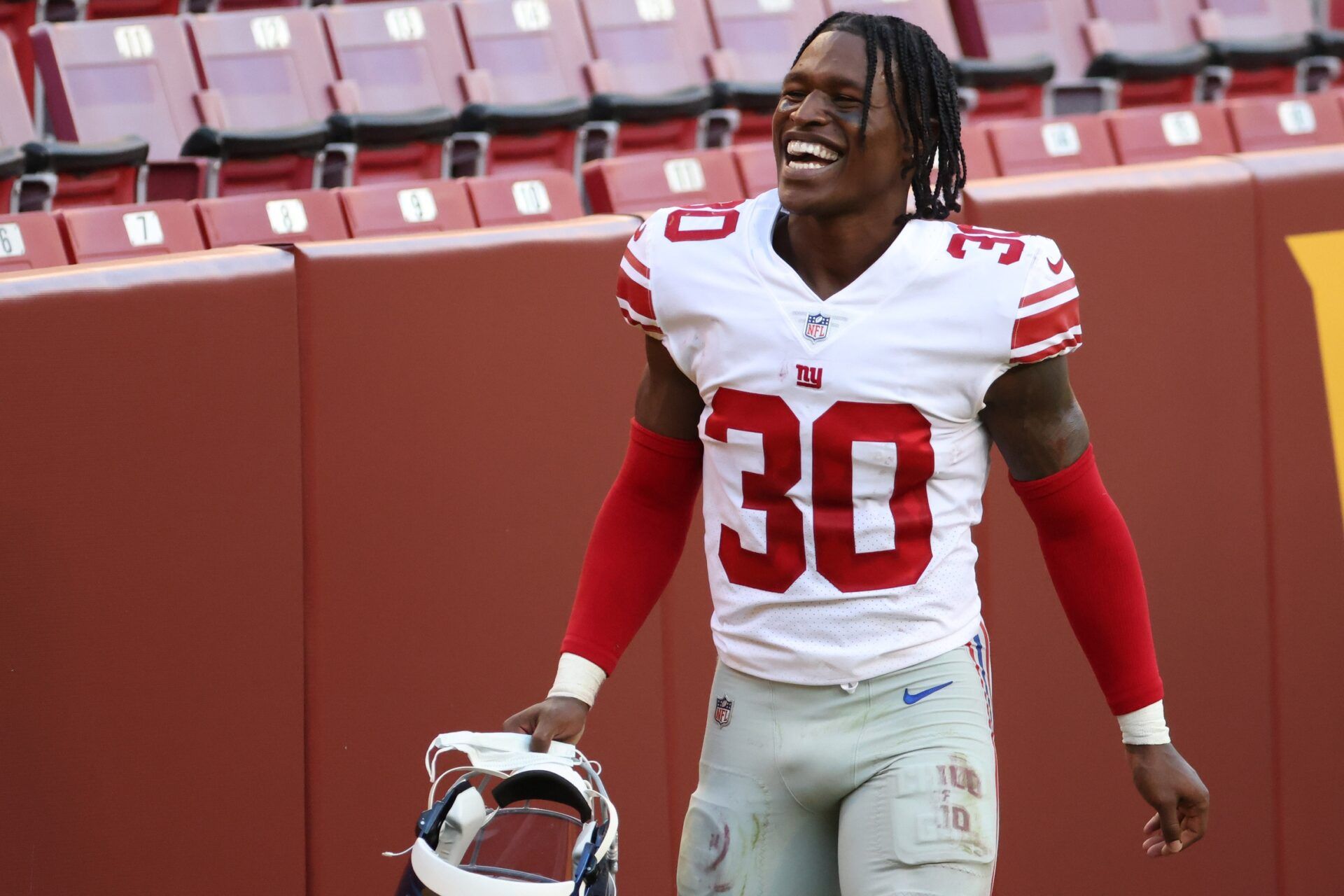 Darnay Holmes (30) smiles while leaving the field after the Giants' game against the Washington Football Team at FedExField.