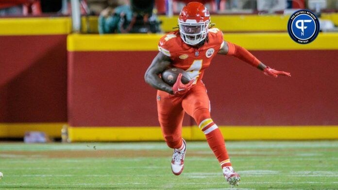 Kansas City Chiefs WR Rashee Rice (4) runs with the ball against the Denver Broncos.