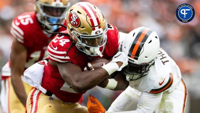 Cleveland Browns safety Juan Thornhill (1) tackles San Francisco 49ers running back Jordan Mason (24) during the third quarter at Cleveland Browns Stadium.