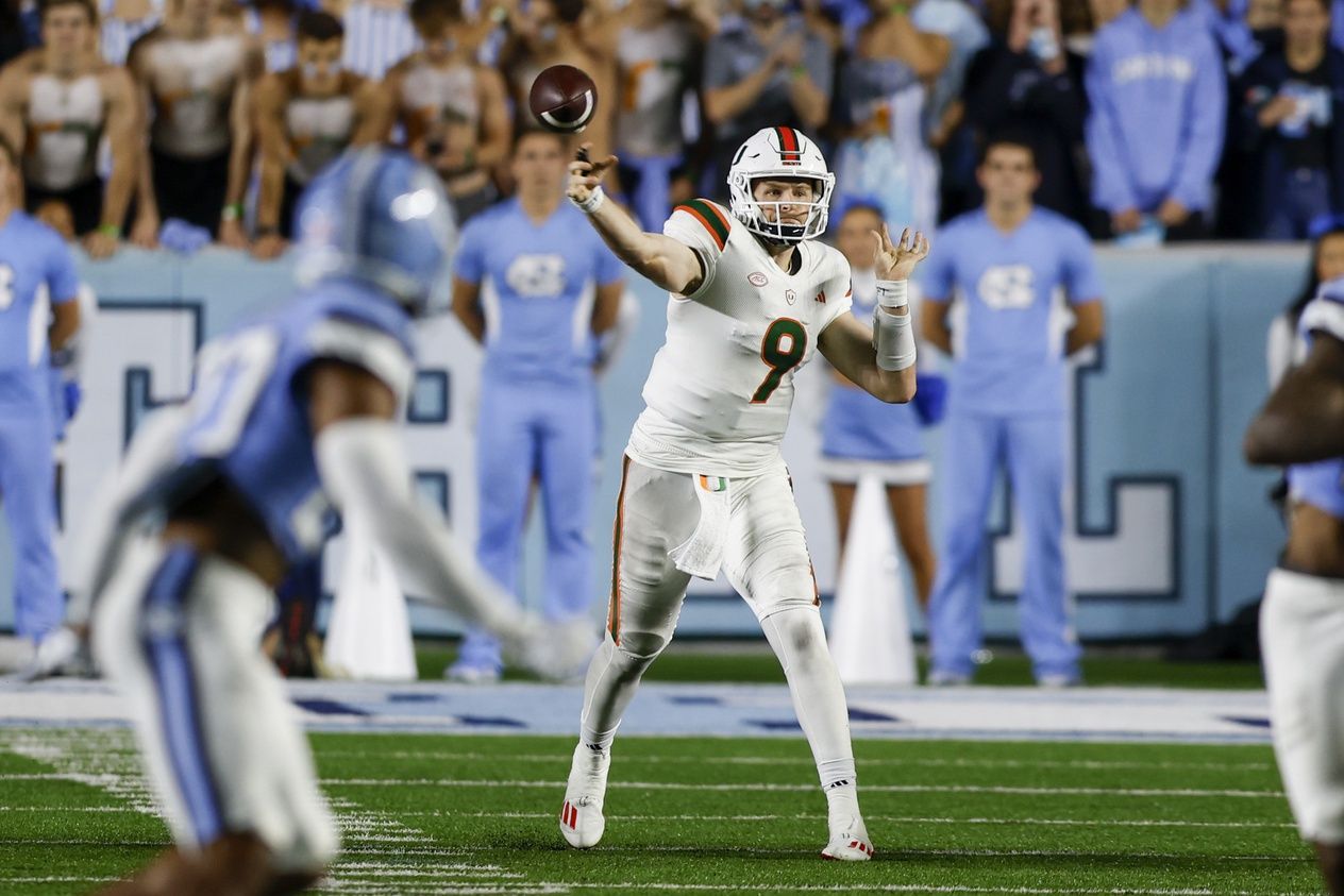 Tyler Van Dyke (9) passes against the North Carolina Tar Heels in the first half at Kenan Memorial Stadium.