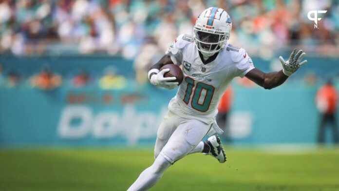 Tyreek Hill (10) runs with the football against the Carolina Panthers during the second quarter at Hard Rock Stadium.