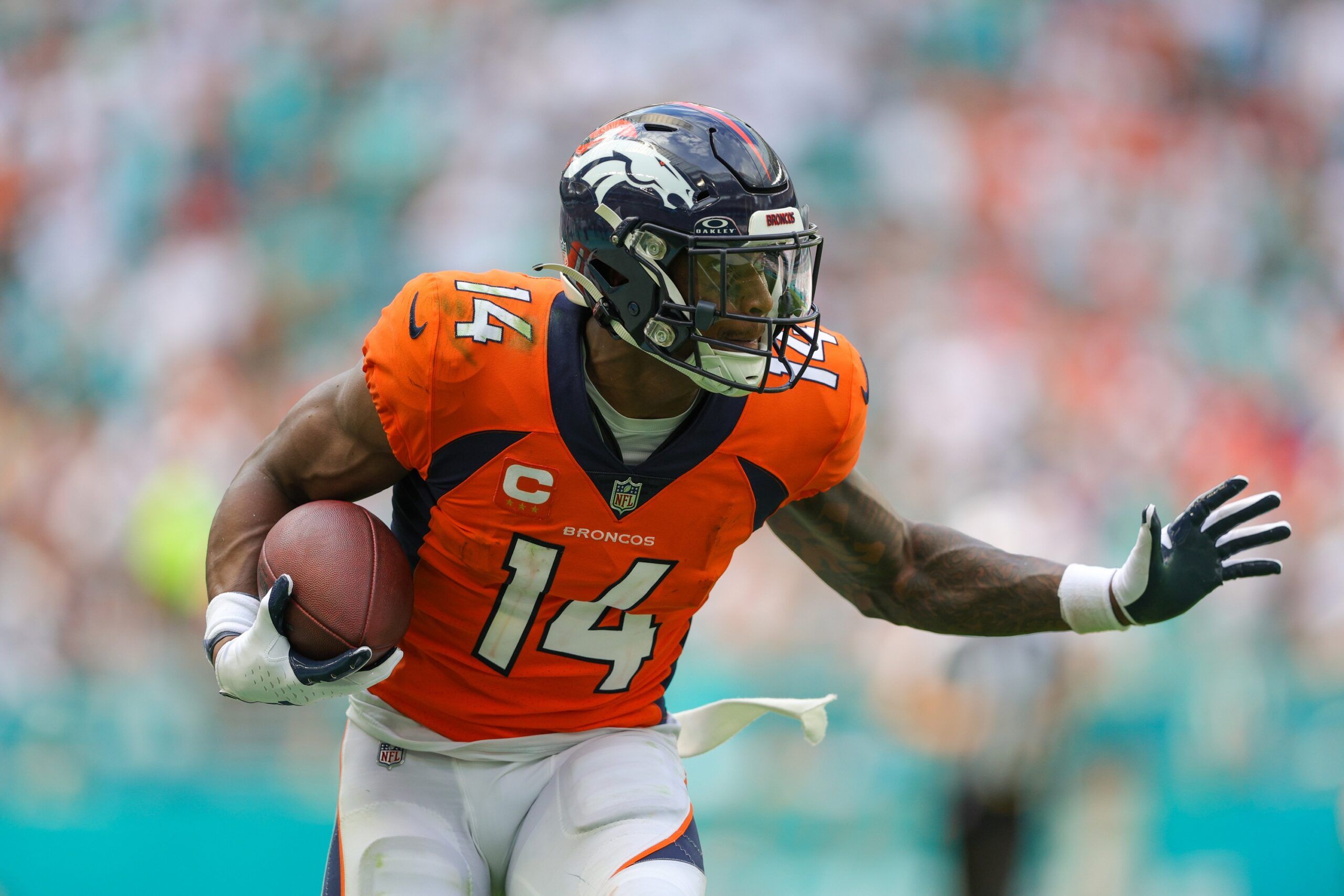 Courtland Sutton (14) runs with the ball against the Miami Dolphins in the third quarter at Hard Rock Stadium.