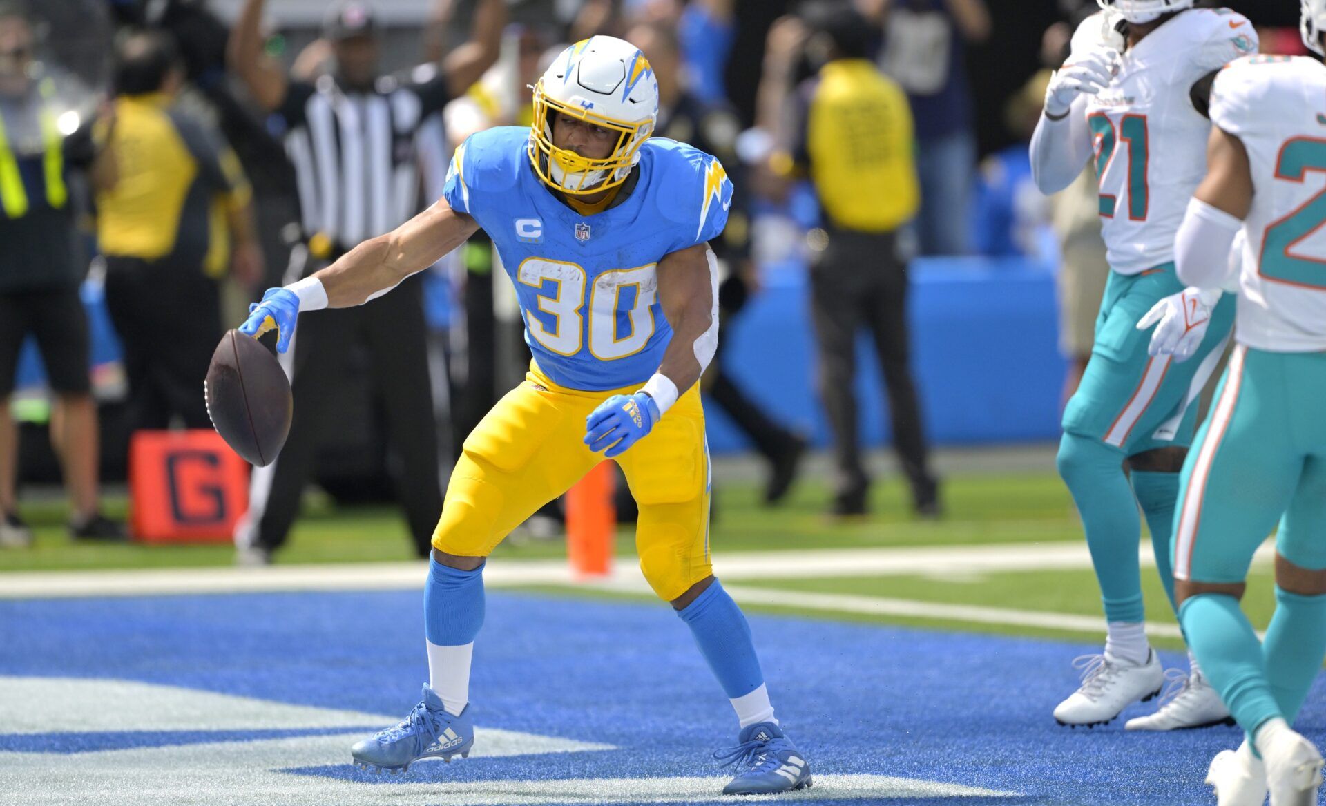 Austin Ekeler (30) celebrates after a touchdown in the first half against the Miami Dolphins at SoFi Stadium.