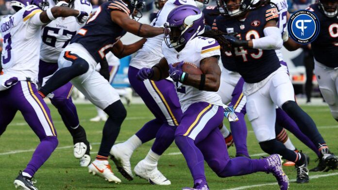 Alexander Mattison (2) rushes the ball against the Chicago Bears during the second half at Soldier Field.