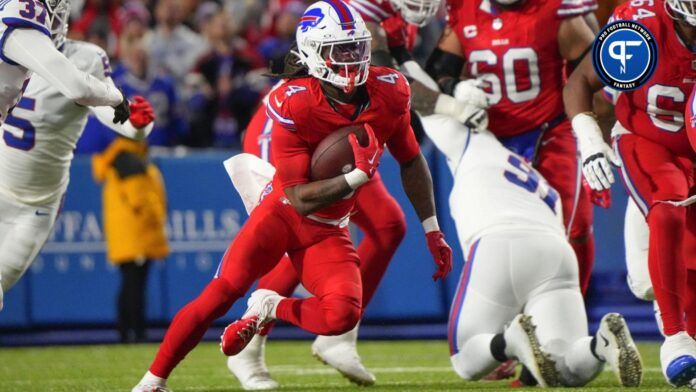 Buffalo Bills running back James Cook (4) runs with the ball against the New York Giants during the first half at Highmark Stadium.