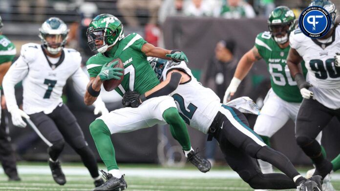 New York Jets wide receiver Garrett Wilson (17) is tackled by Philadelphia Eagles safety Reed Blankenship (32).